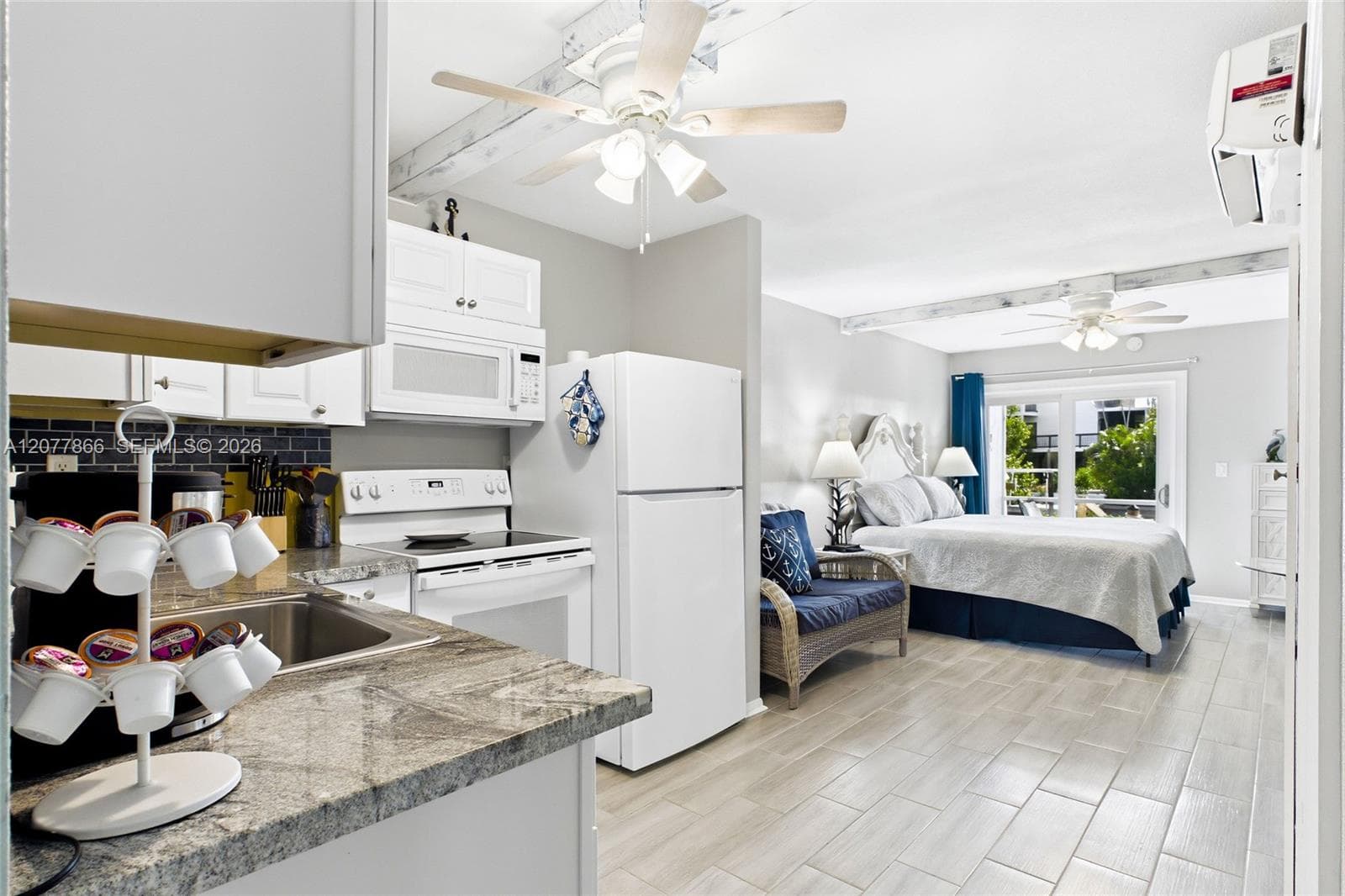 THE CRANE ROOM Each thoughtfully designed studio features an open bedroom and living area, creating a comfortable and functional space with a fresh coastal feel.
