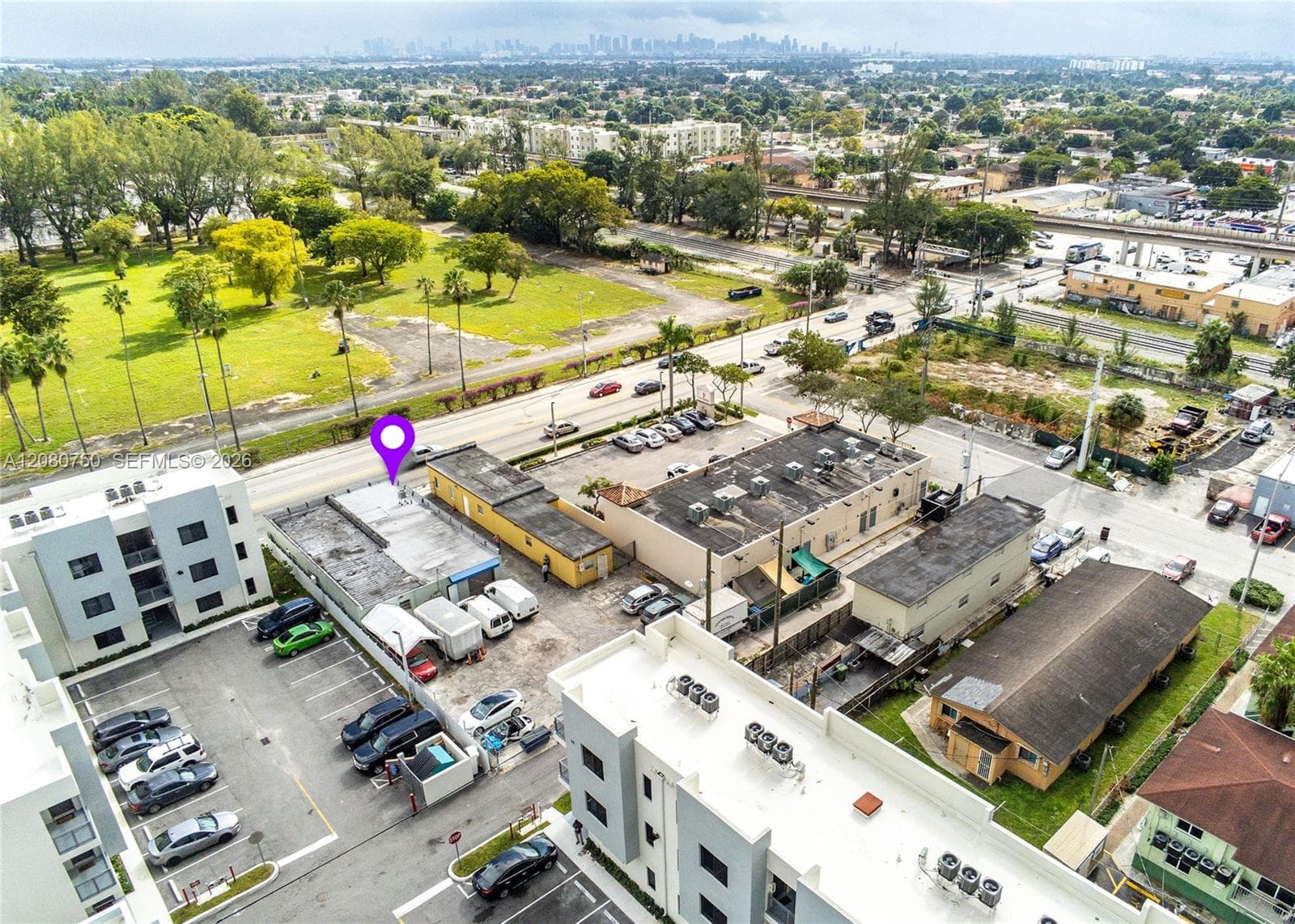 An urban vantage point where commercial utility meets the lush greenery of iconic Hialeah Park, creating an inspiring setting for operations or high-density residential living.