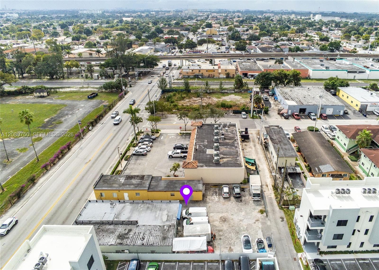 Expansive rear yard offering secure parking, equipment staging, or fleet storage for an active business—with the underlying land value to support future ground-up expansion.