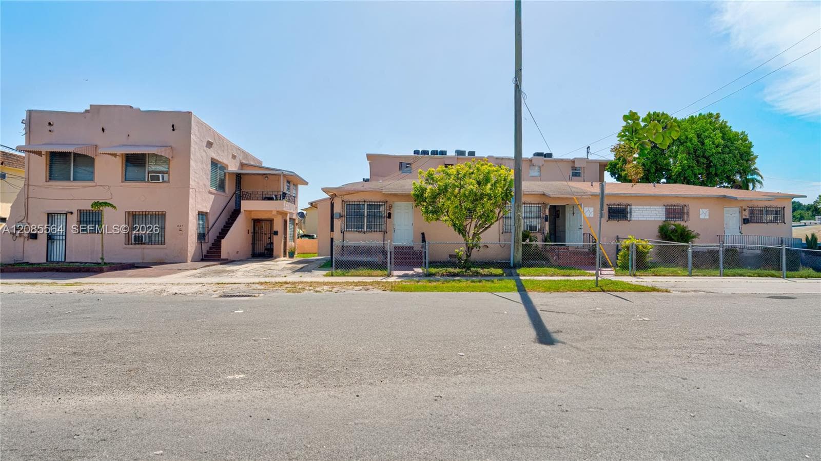 Corner property with 1937 duplex on left and 1954 triplex on the right. Property faces 18 Ave with side to 7th Street. One block from 8 Street.