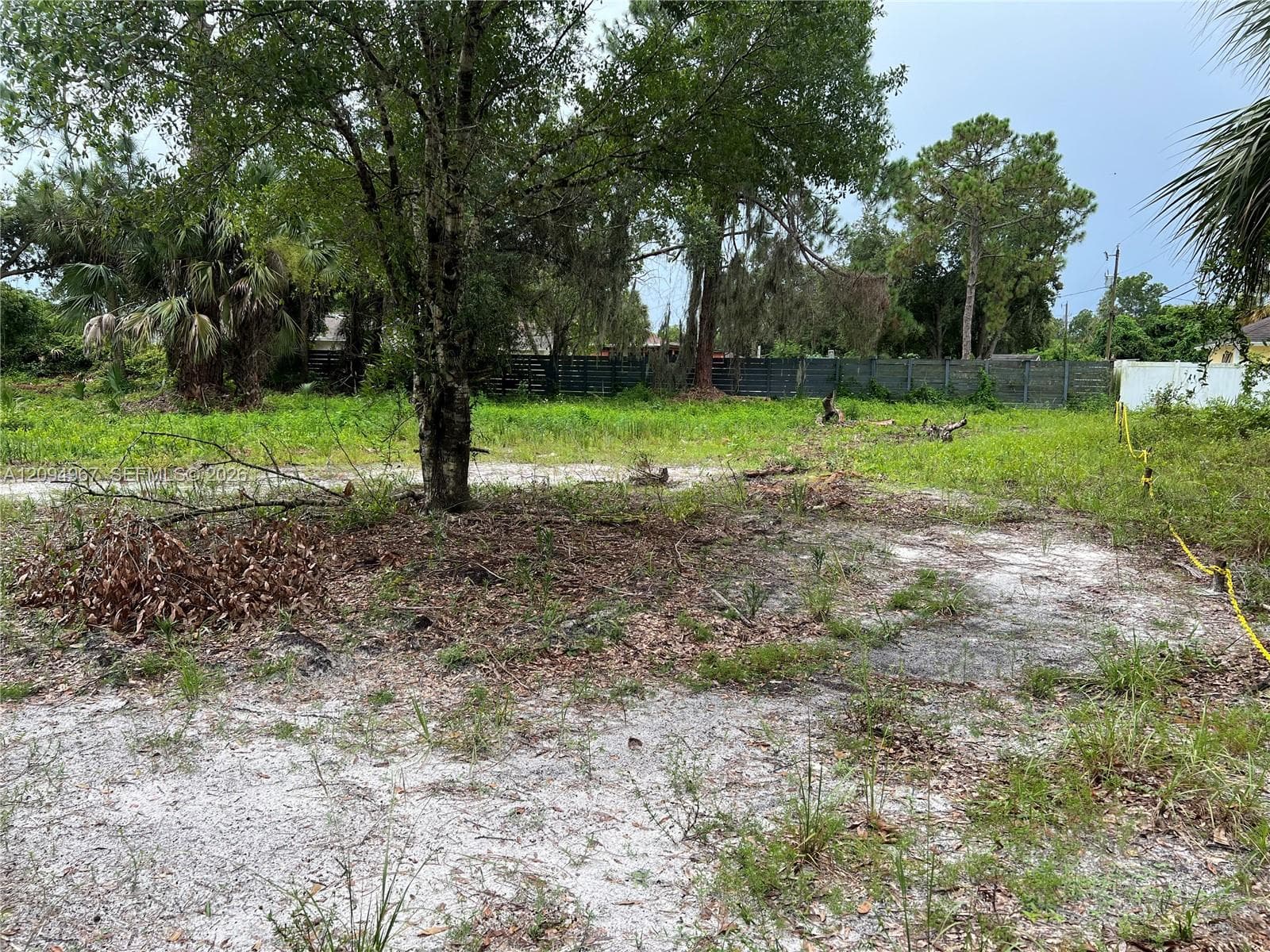 Ground-level view of this spacious 1-acre double lot, offering ample space for a custom home and outdoor living.